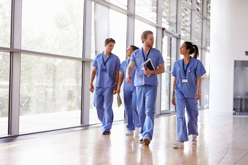 healthcare job outlook. Image of healthcare professionals walking