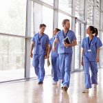 healthcare job outlook. Image of healthcare professionals walking