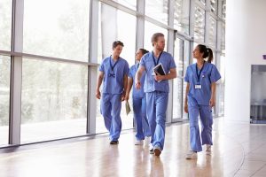 healthcare job outlook. Image of healthcare professionals walking