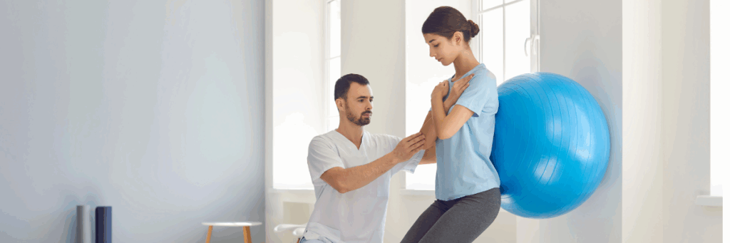 physical therapist helping young woman with PT exercises